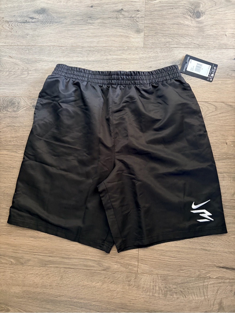 Nike Black Athletic Shorts with White Swoosh